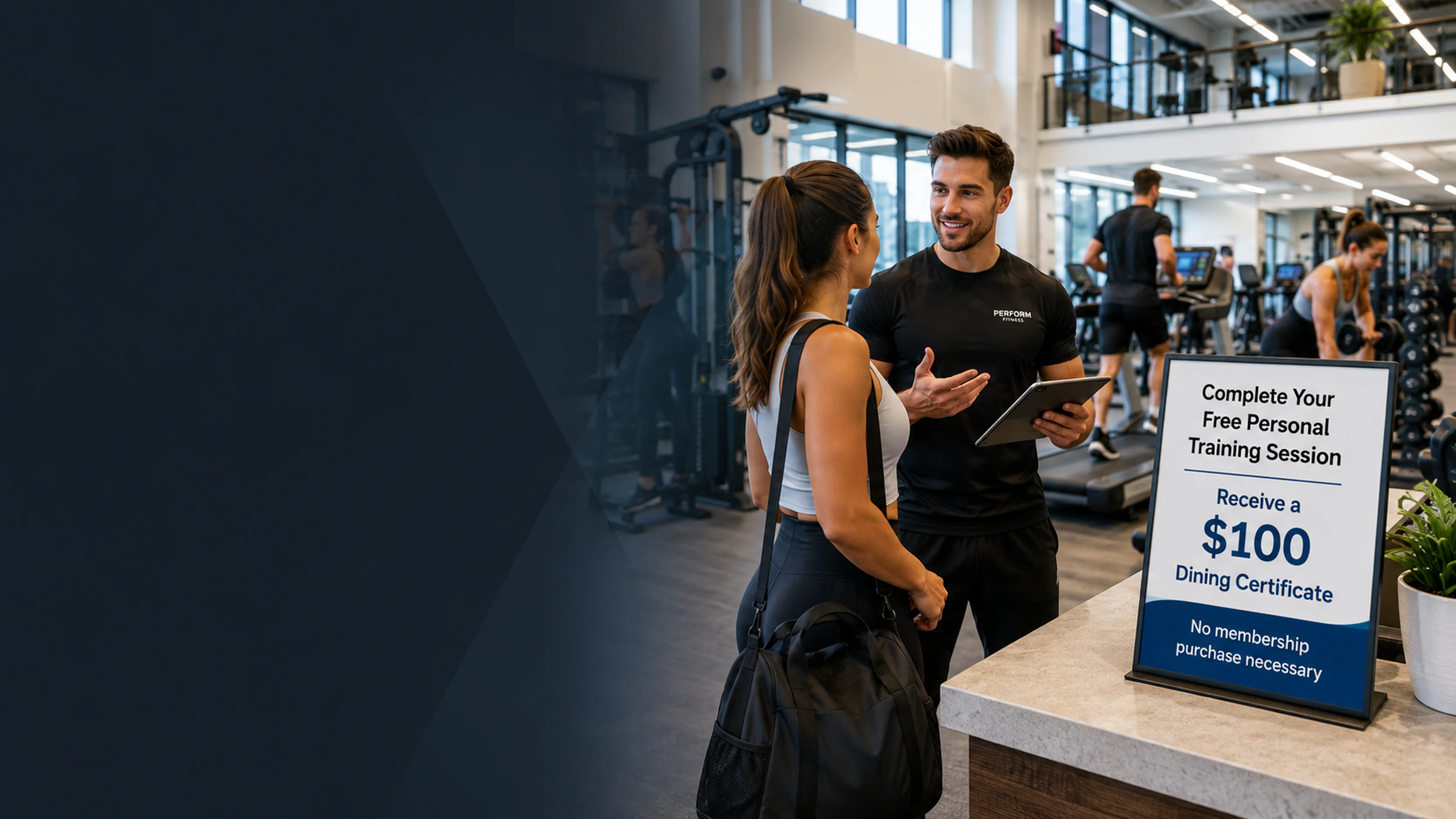 Personal trainer greeting a prospective member at a gym front desk beside a sign offering a $100 dining certificate for completing a free personal training session